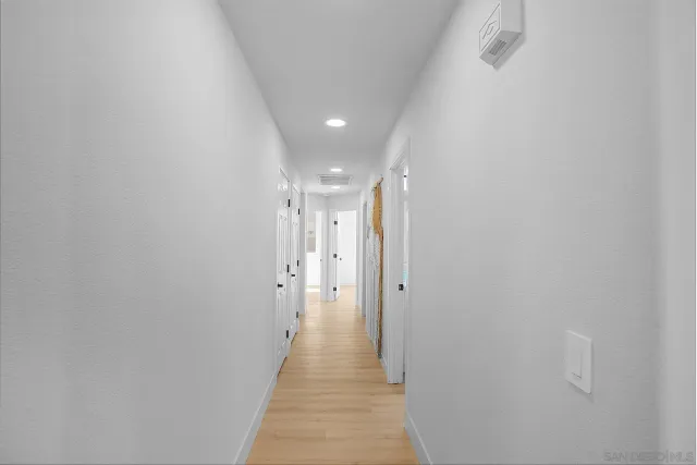 a white toilet sitting next to a shower