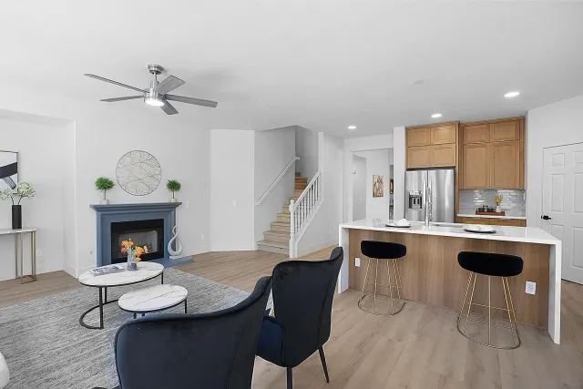 a living room with furniture a window and a fireplace