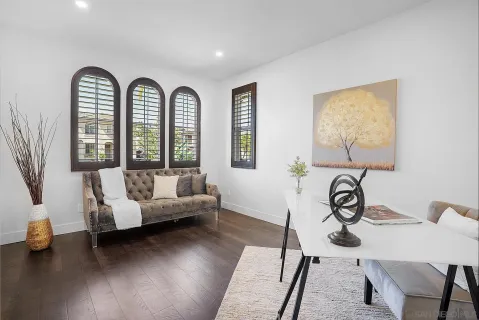 a living room with furniture and a window