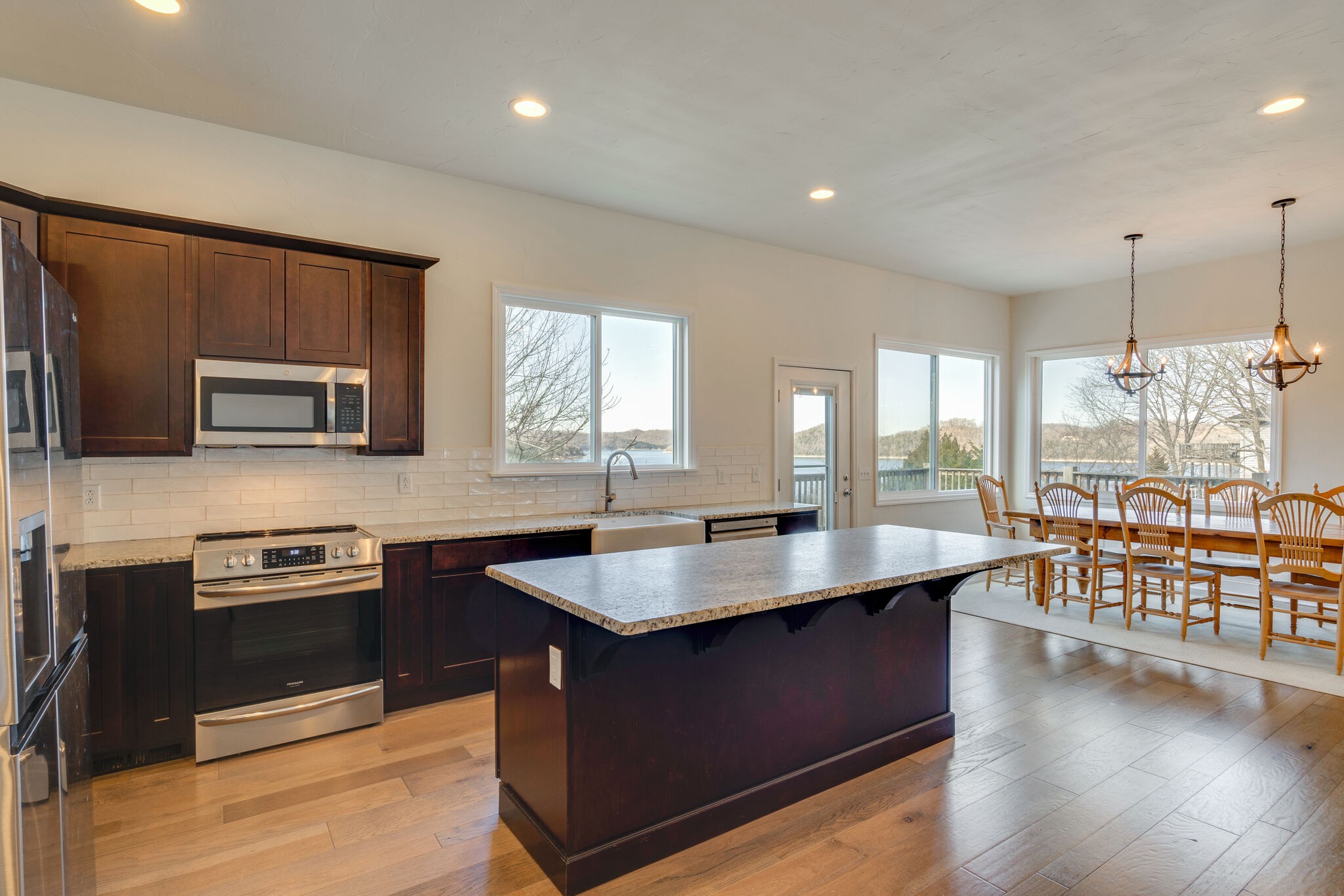 609 Floating Mill Village Road Silver Point, TN 38582 - Photo 11 of 64 a kitchen with stainless steel appliances granite countertop wooden cabinets a stove and a sink