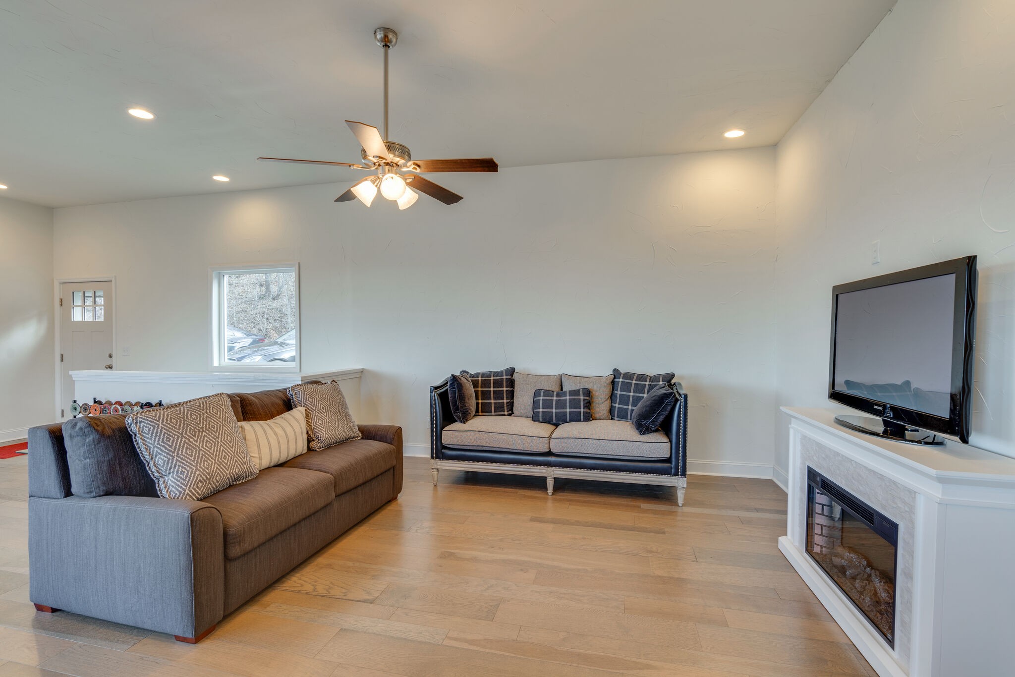 609 Floating Mill Village Road Silver Point, TN 38582 - Photo 12 of 64 a living room with furniture and a flat screen tv