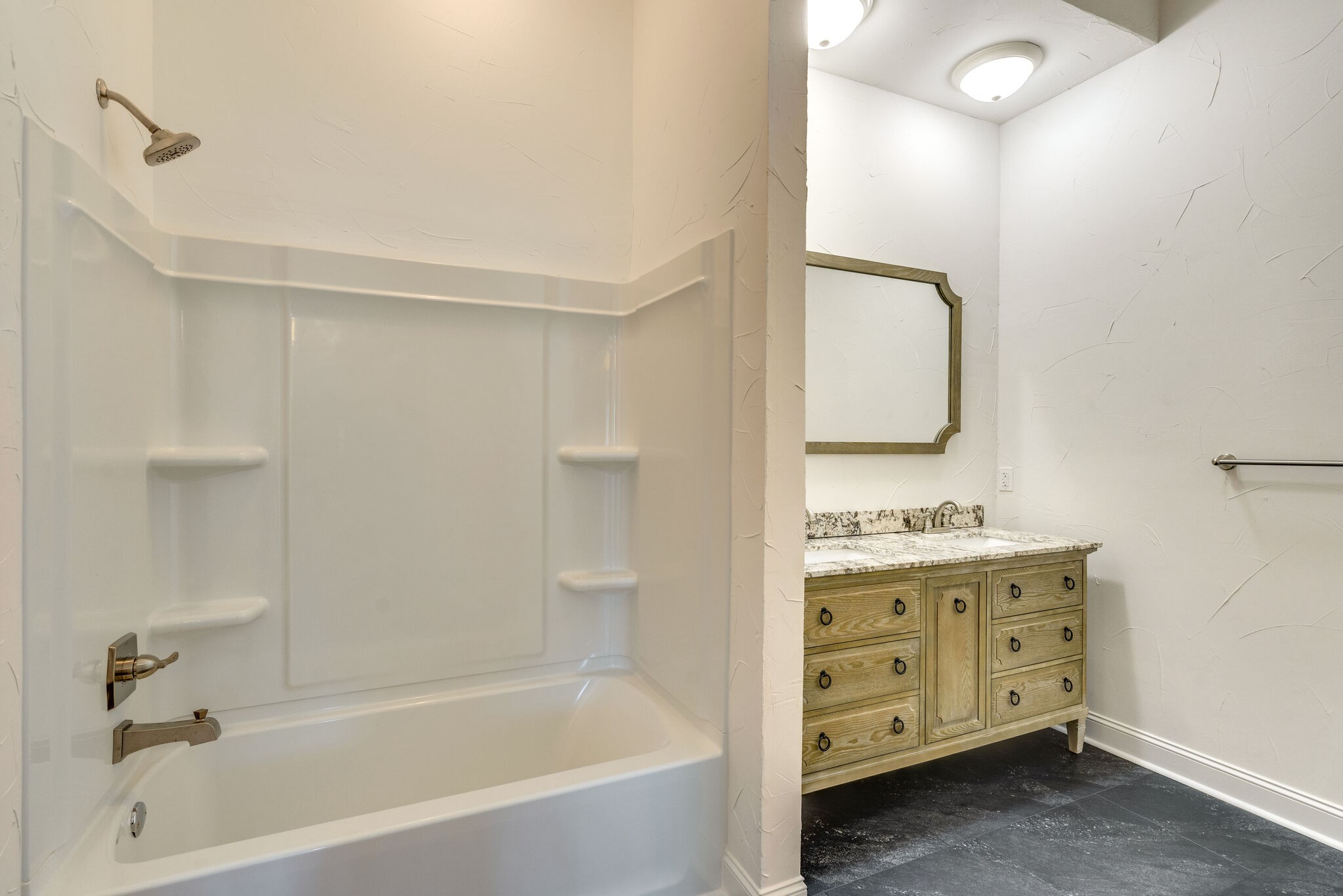 609 Floating Mill Village Road Silver Point, TN 38582 - Photo 31 of 64 a bathroom with a granite countertop sink a mirror and a bathtub