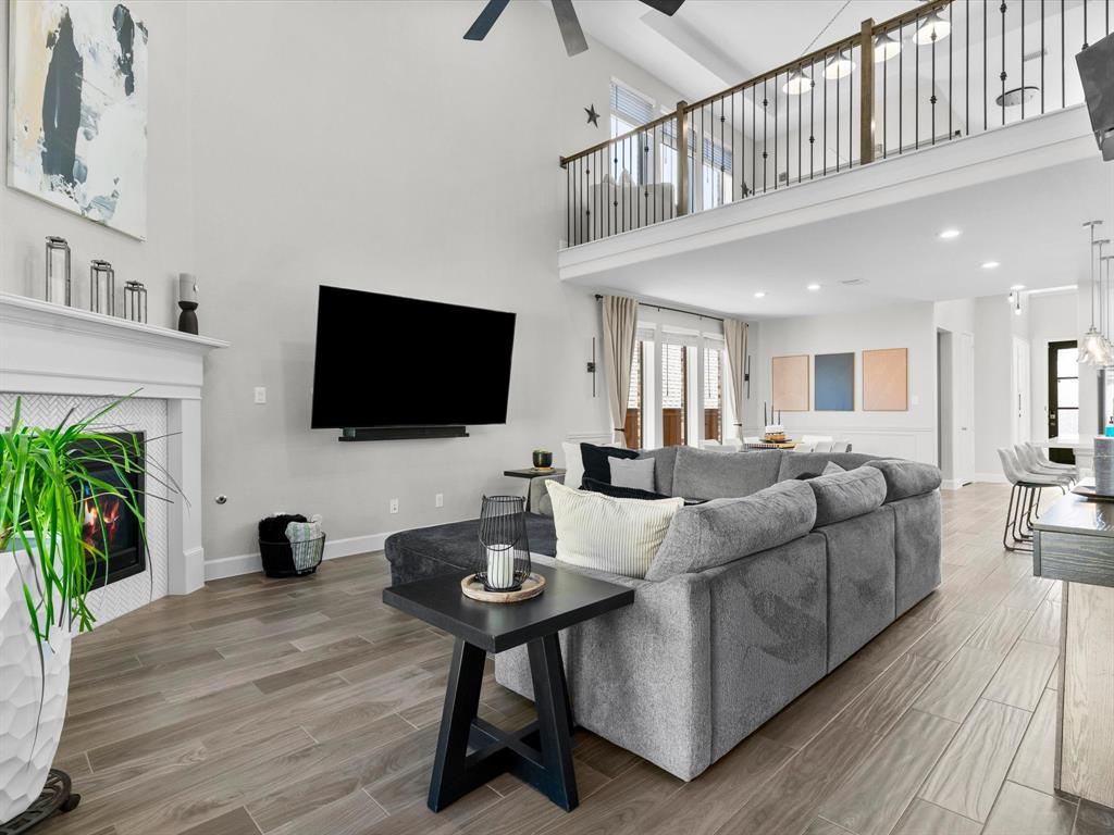 112 Pecan Court Rhome, TX 76078 - Photo 11 of 38 Spacious living room filled with natural light, perfect for relaxing or entertaining in this beautiful home located in the heart of Rhome, TX.