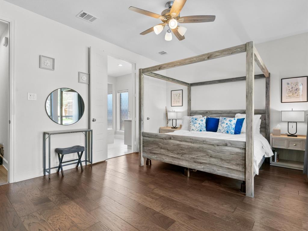 112 Pecan Court Rhome, TX 76078 - Photo 18 of 38 Spacious primary suite offering comfort, privacy, and a peaceful retreat at the end of the day.