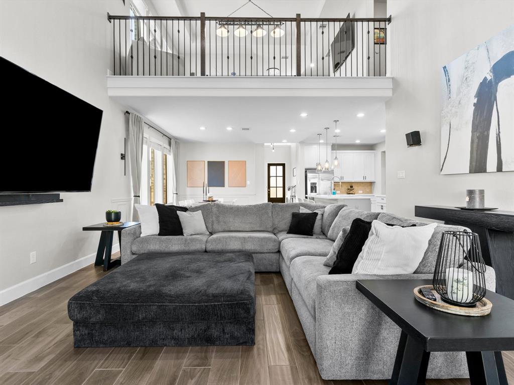 112 Pecan Court Rhome, TX 76078 - Photo 23 of 38 Living area featuring a high ceiling, wood finished floors, and recessed lighting