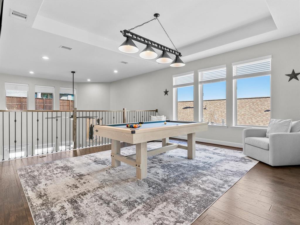 112 Pecan Court Rhome, TX 76078 - Photo 25 of 38 Game room with a tray ceiling, hardwood / wood-style flooring, billiards, and recessed lighting