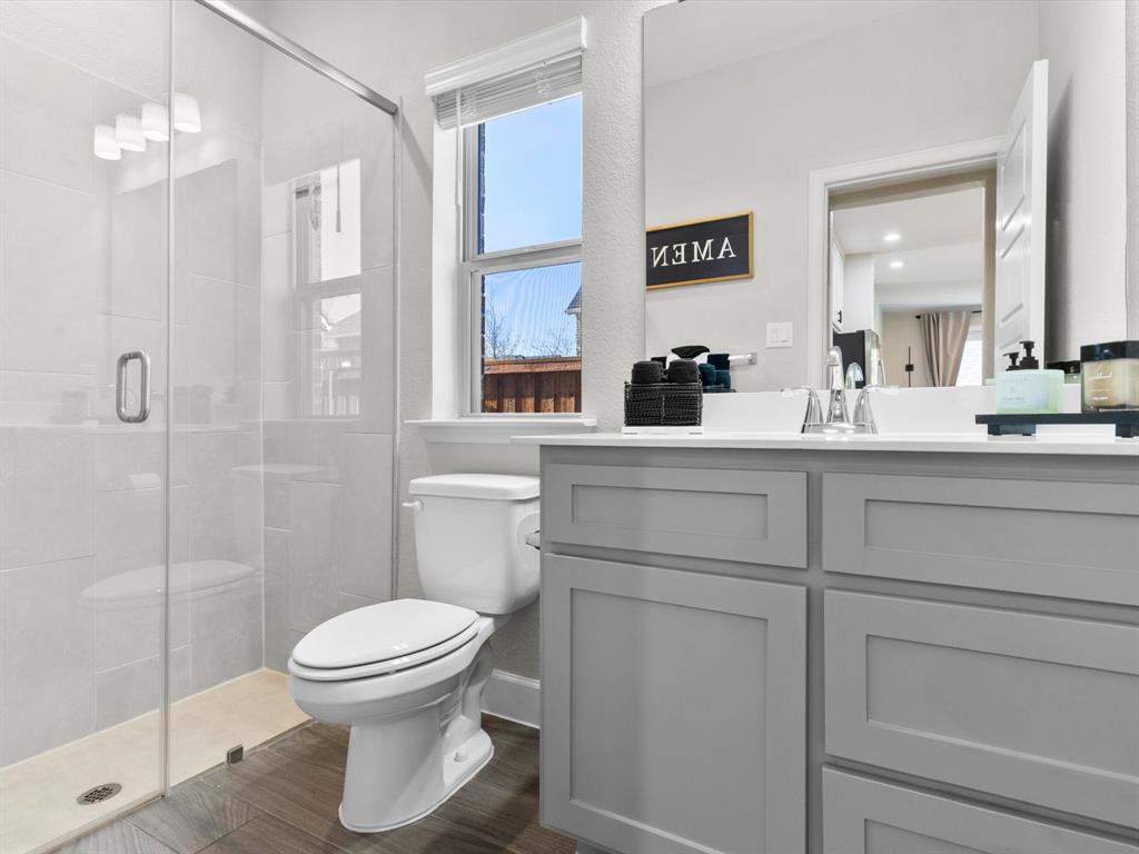 112 Pecan Court Rhome, TX 76078 - Photo 30 of 38 onvenient secondary bathroom designed for comfort and functionality.