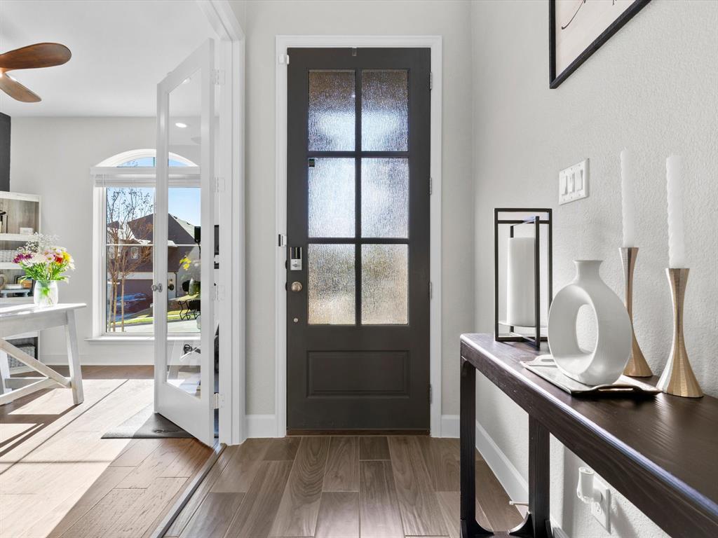 112 Pecan Court Rhome, TX 76078 - Photo 6 of 38 Step inside this thoughtfully designed home in Rhome, Texas featuring a bright and welcoming entry that opens into the spacious main living areas.