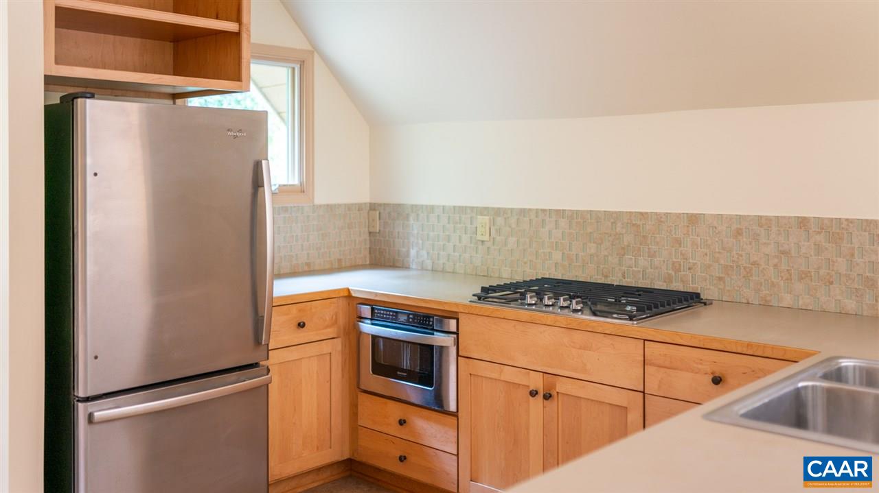 4365 Taylor Creek Road Afton, VA 22920 - Photo 14 of 49 a kitchen with cabinets and a stove top oven