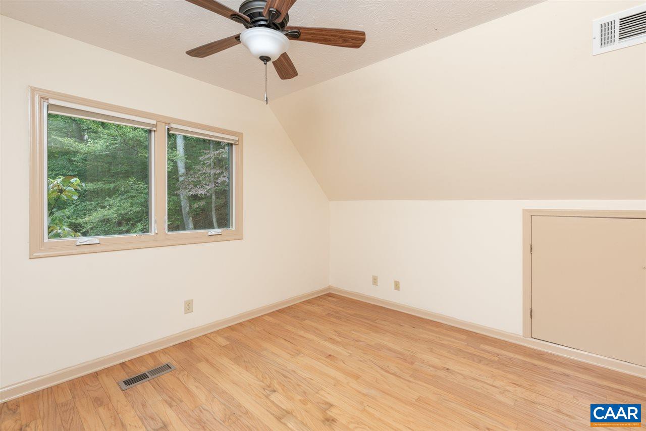 4365 Taylor Creek Road Afton, VA 22920 - Photo 23 of 49 an empty room with a window and a ceiling fan