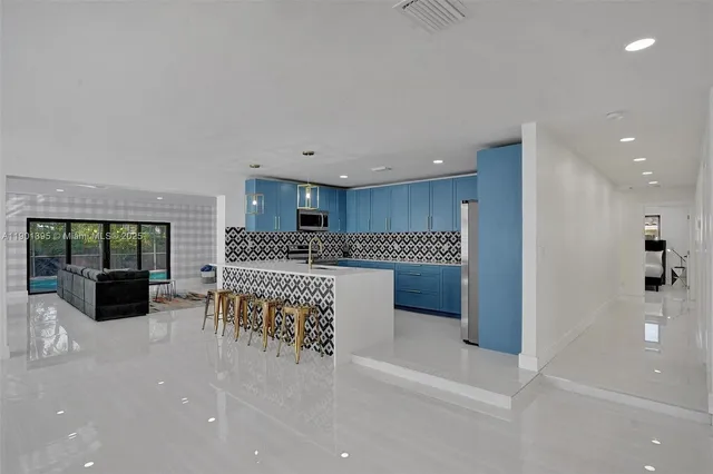 a bedroom with a bed and a night stand