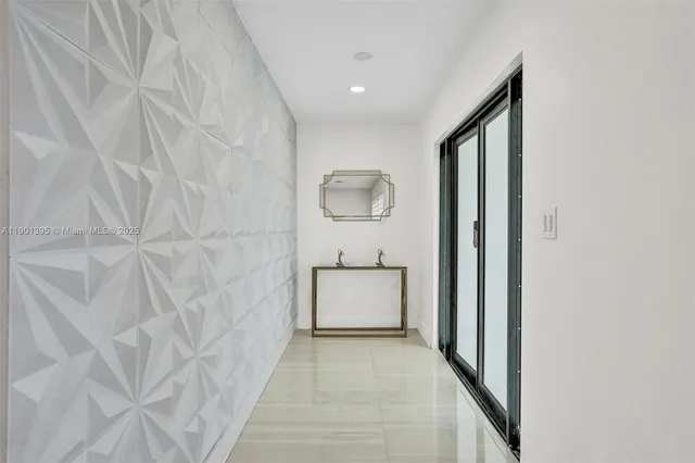a kitchen with stainless steel appliances granite countertop a sink and a refrigerator