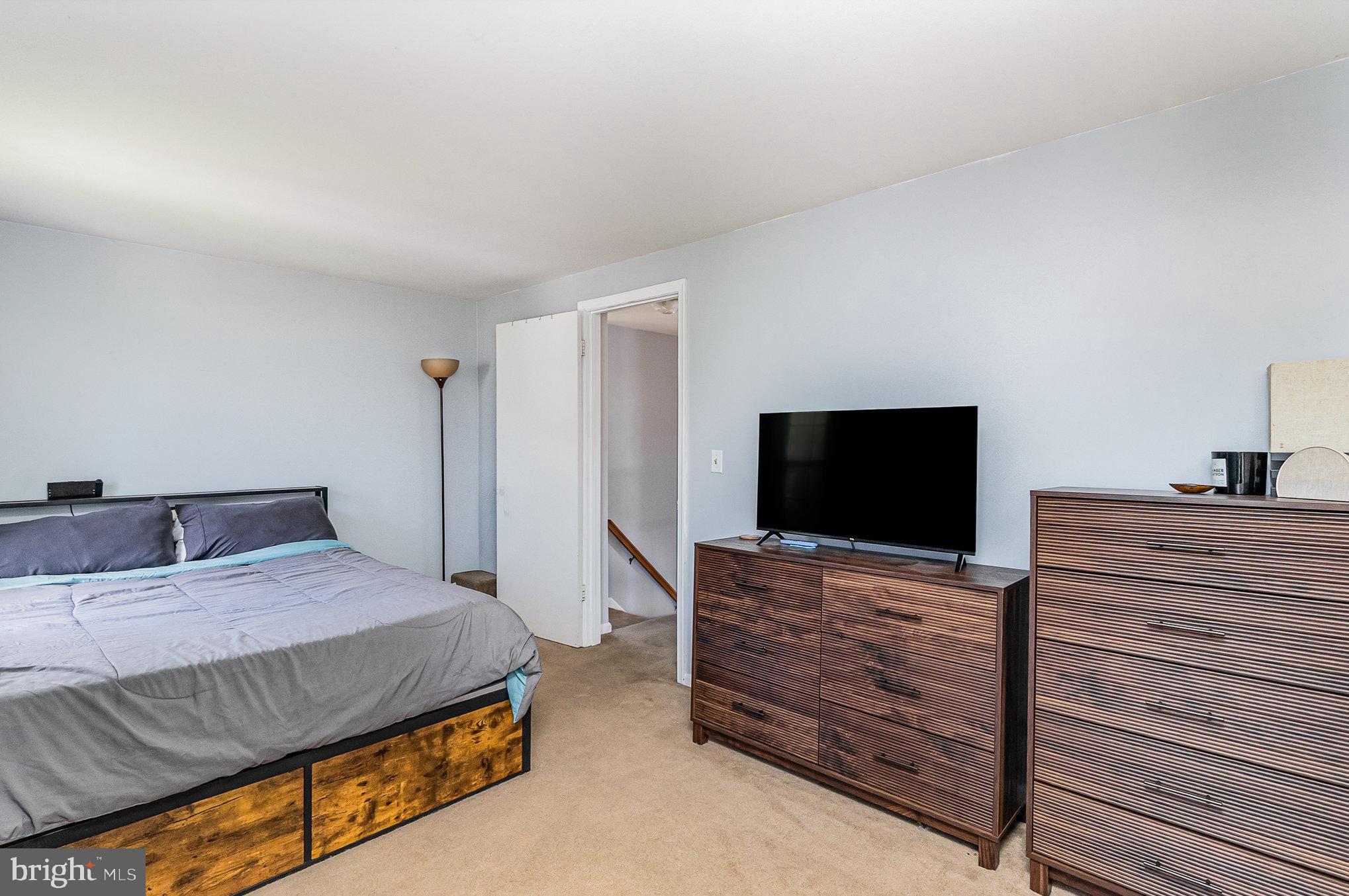 1213 Brice Square Belcamp, MD 21017 - Photo 16 of 23 a bedroom with a bed and a flat screen tv