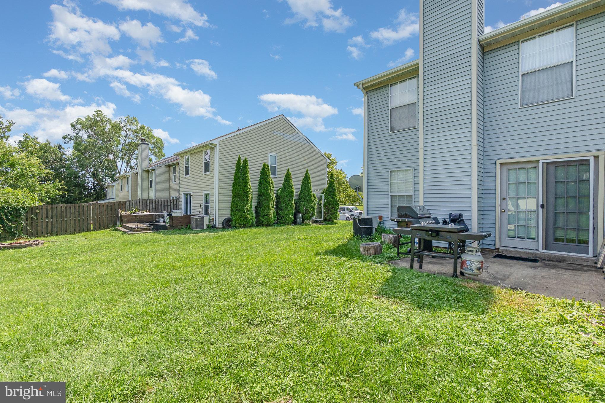 1213 Brice Square Belcamp, MD 21017 - Photo 21 of 23 a view of a house with backyard sitting area and garden