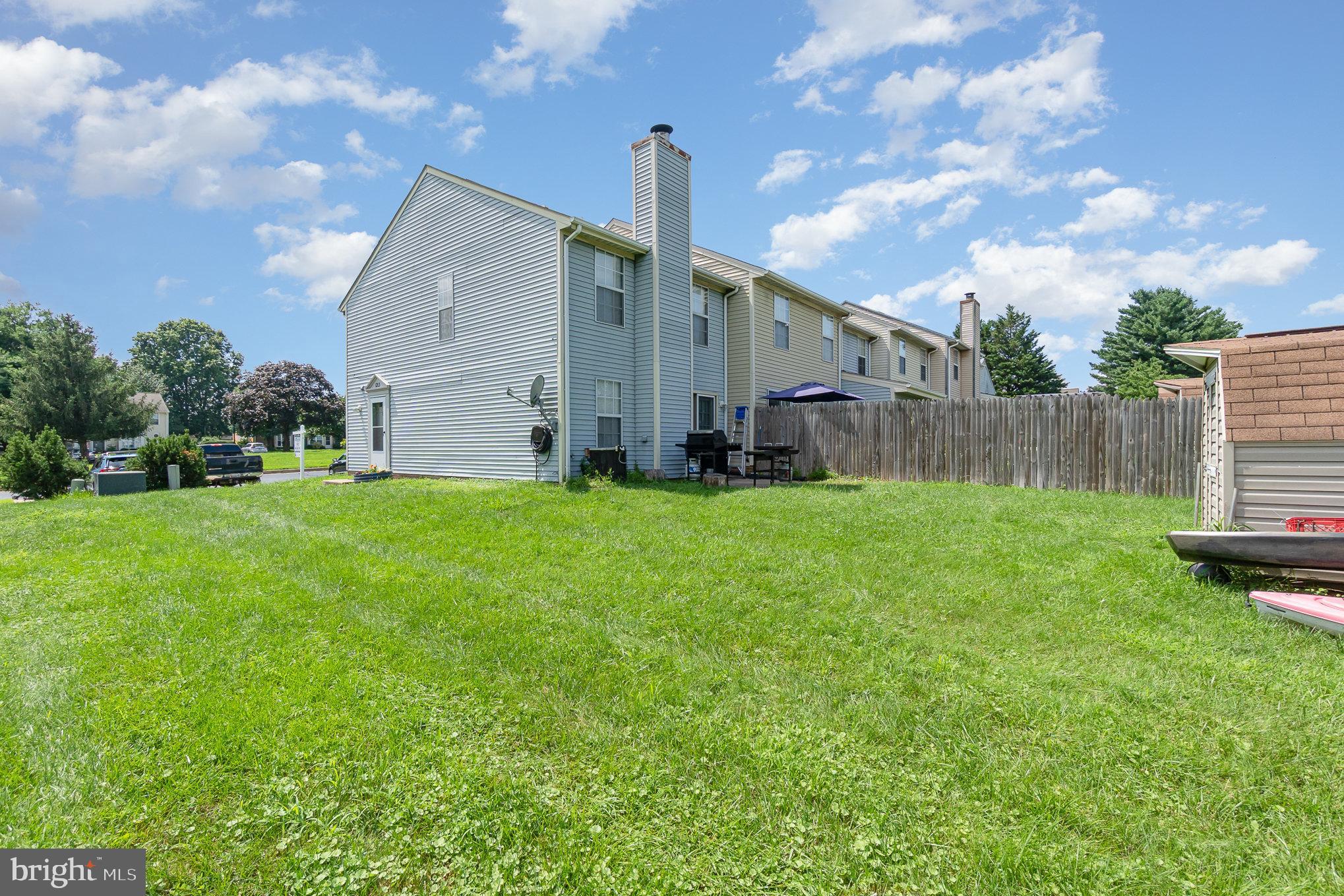 1213 Brice Square Belcamp, MD 21017 - Photo 22 of 23 a backyard of a house with table and chairs