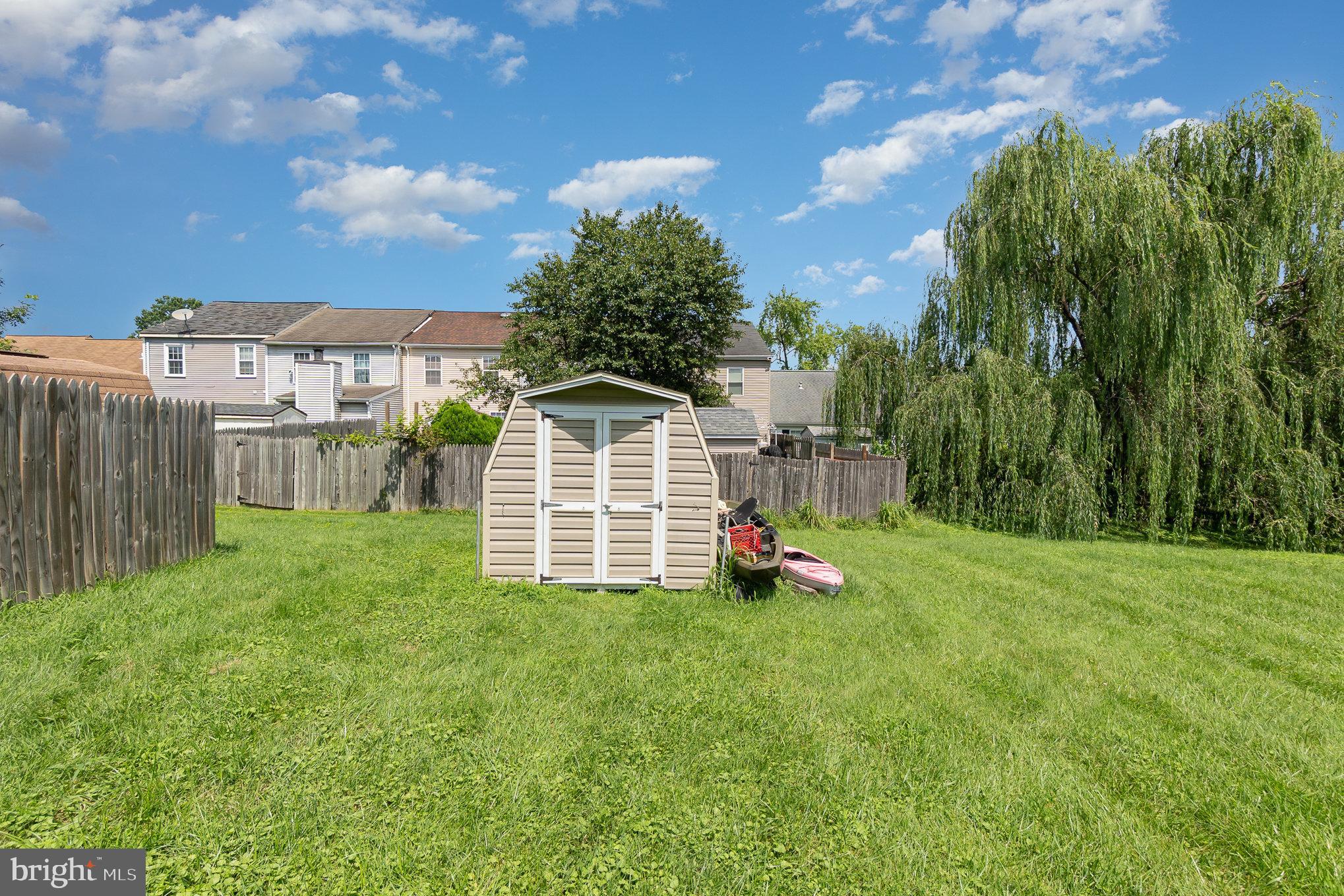 1213 Brice Square Belcamp, MD 21017 - Photo 23 of 23 a view of a house with a yard and sitting area