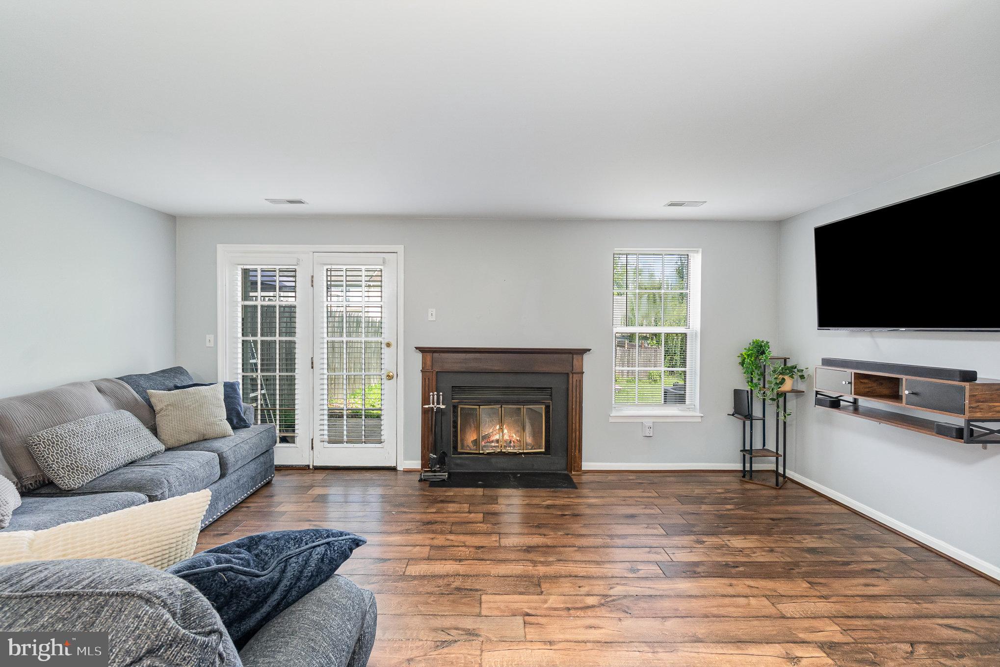 1213 Brice Square Belcamp, MD 21017 - Photo 4 of 23 a living room with furniture and a fireplace