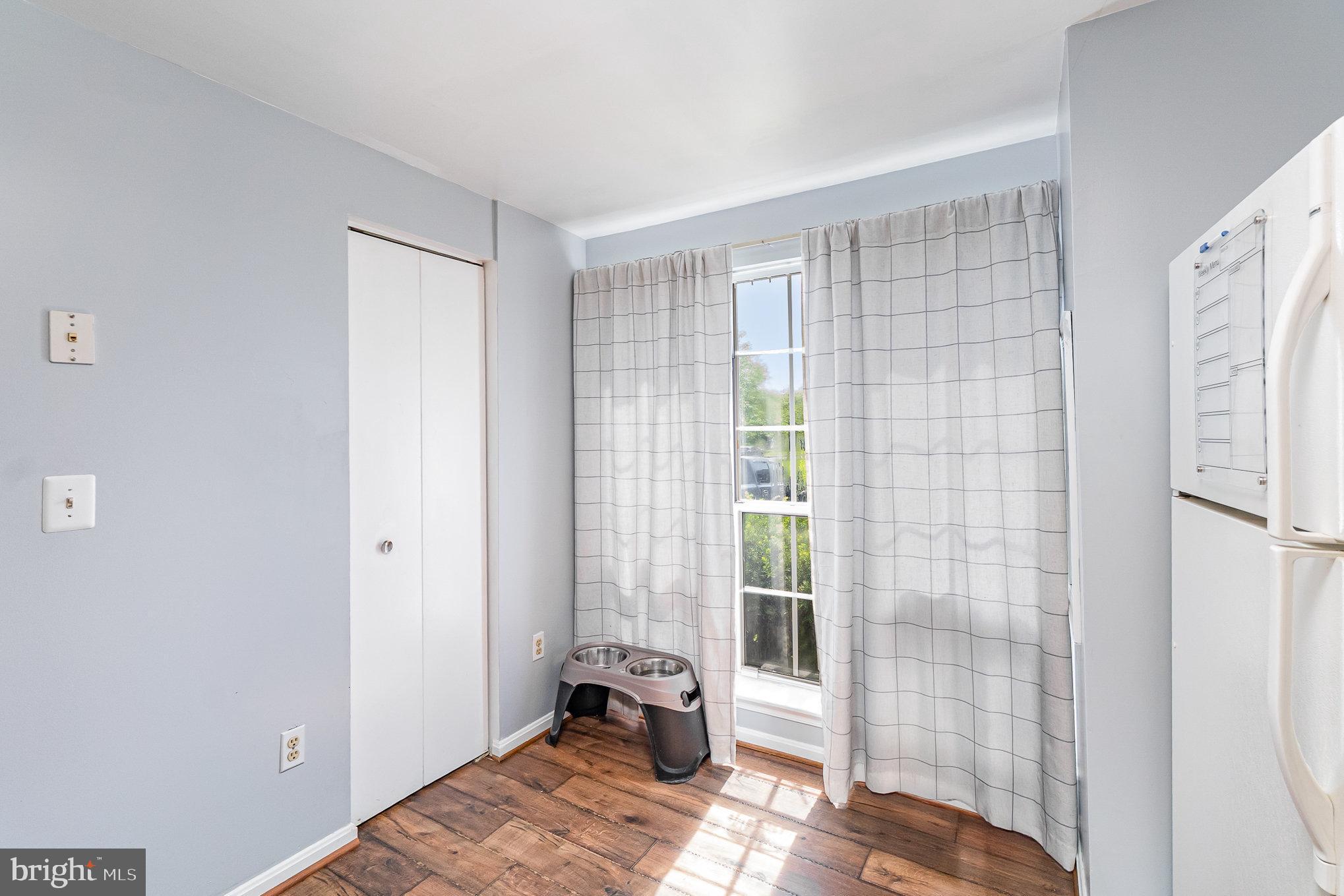 1213 Brice Square Belcamp, MD 21017 - Photo 9 of 23 a bedroom with a bed and wooden floor