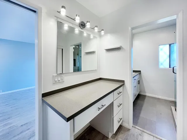 a room with a table and chandelier