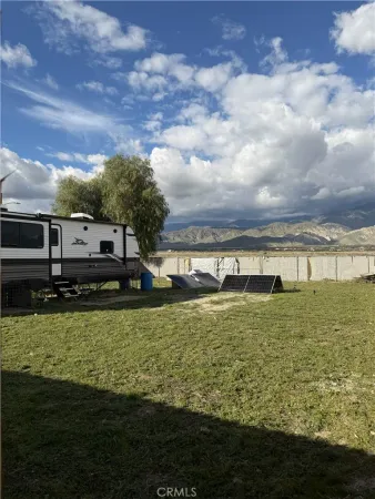 a view of a large pool with a big yard