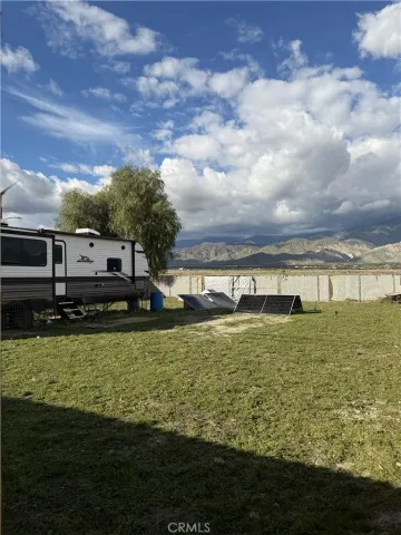 a view of a large pool with a big yard
