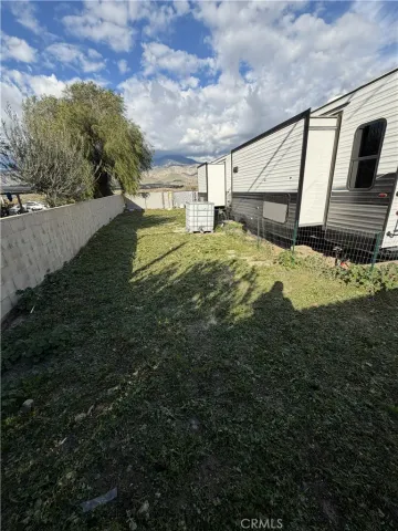 a view of a large pool with a big yard