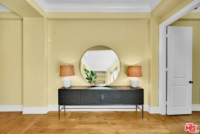 a living room with furniture and a book shelf