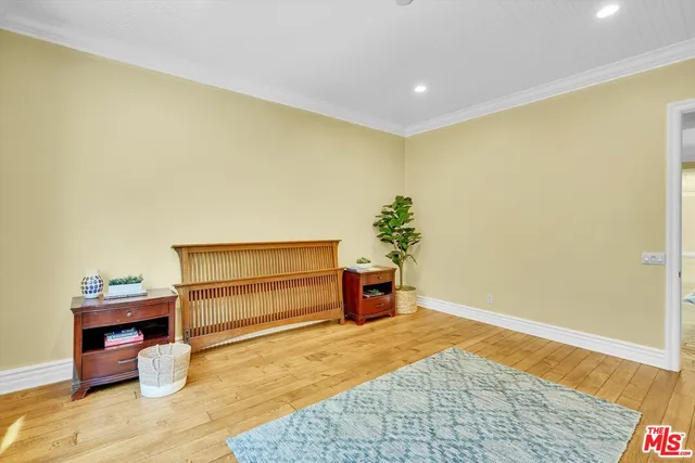 a view of a chair and table in backyard of the house