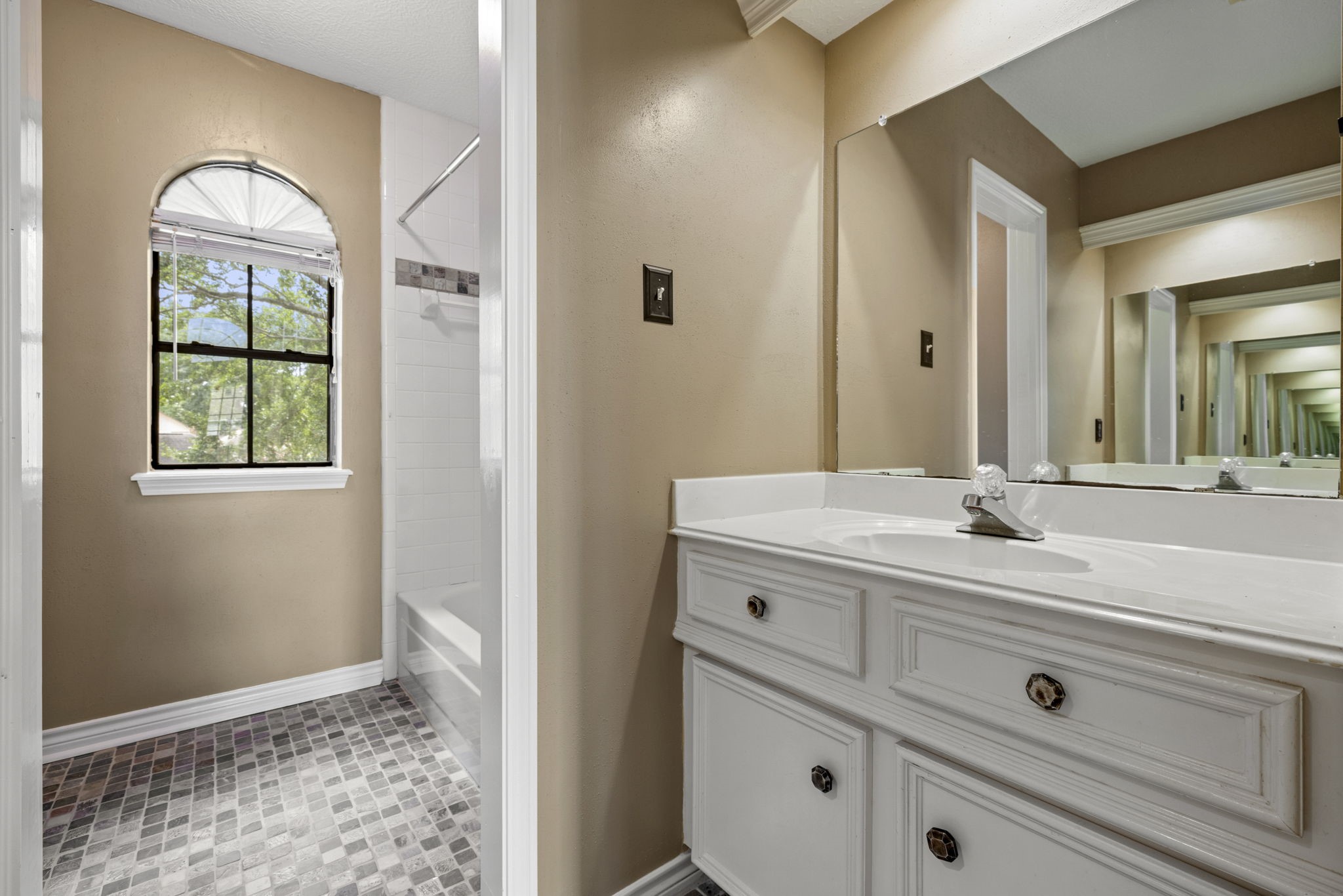 5802 Ashmere Lane Spring, TX 77379 - Photo 14 of 19 a bathroom with a sink a vanity and a mirror