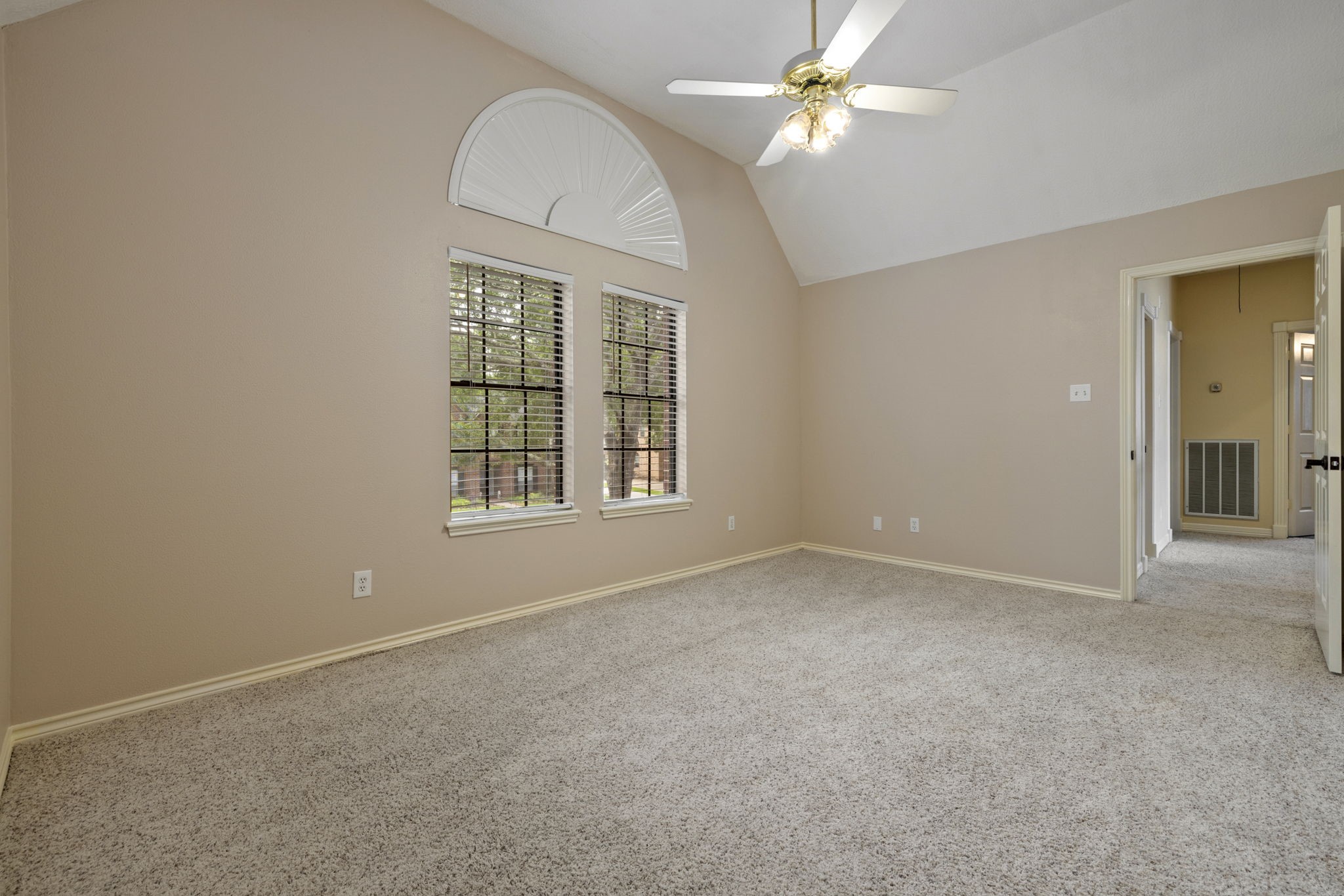 5802 Ashmere Lane Spring, TX 77379 - Photo 15 of 19 an empty room with windows and fan