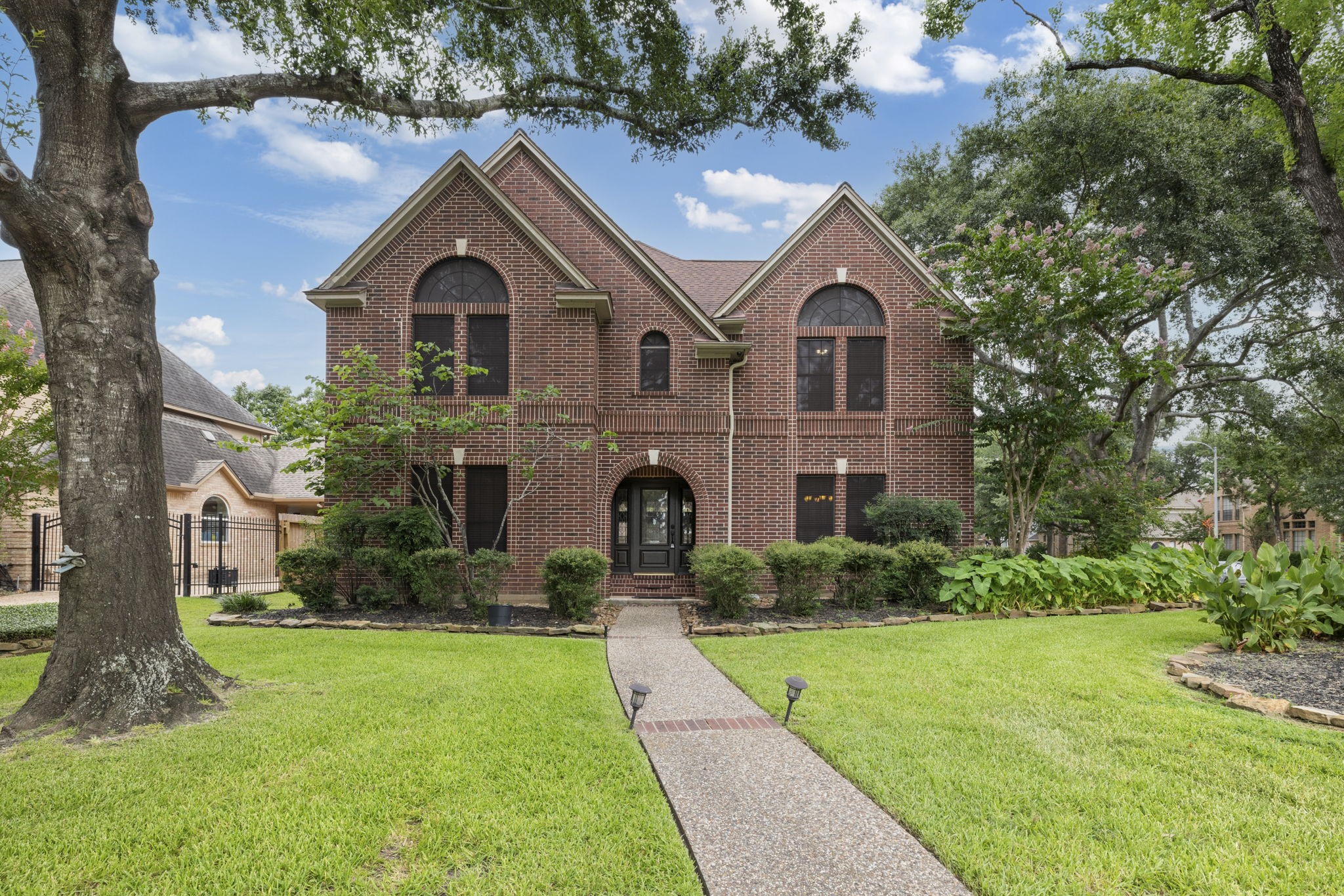 5802 Ashmere Lane Spring, TX 77379 - Photo 16 of 19 a front view of a house with yard and green space