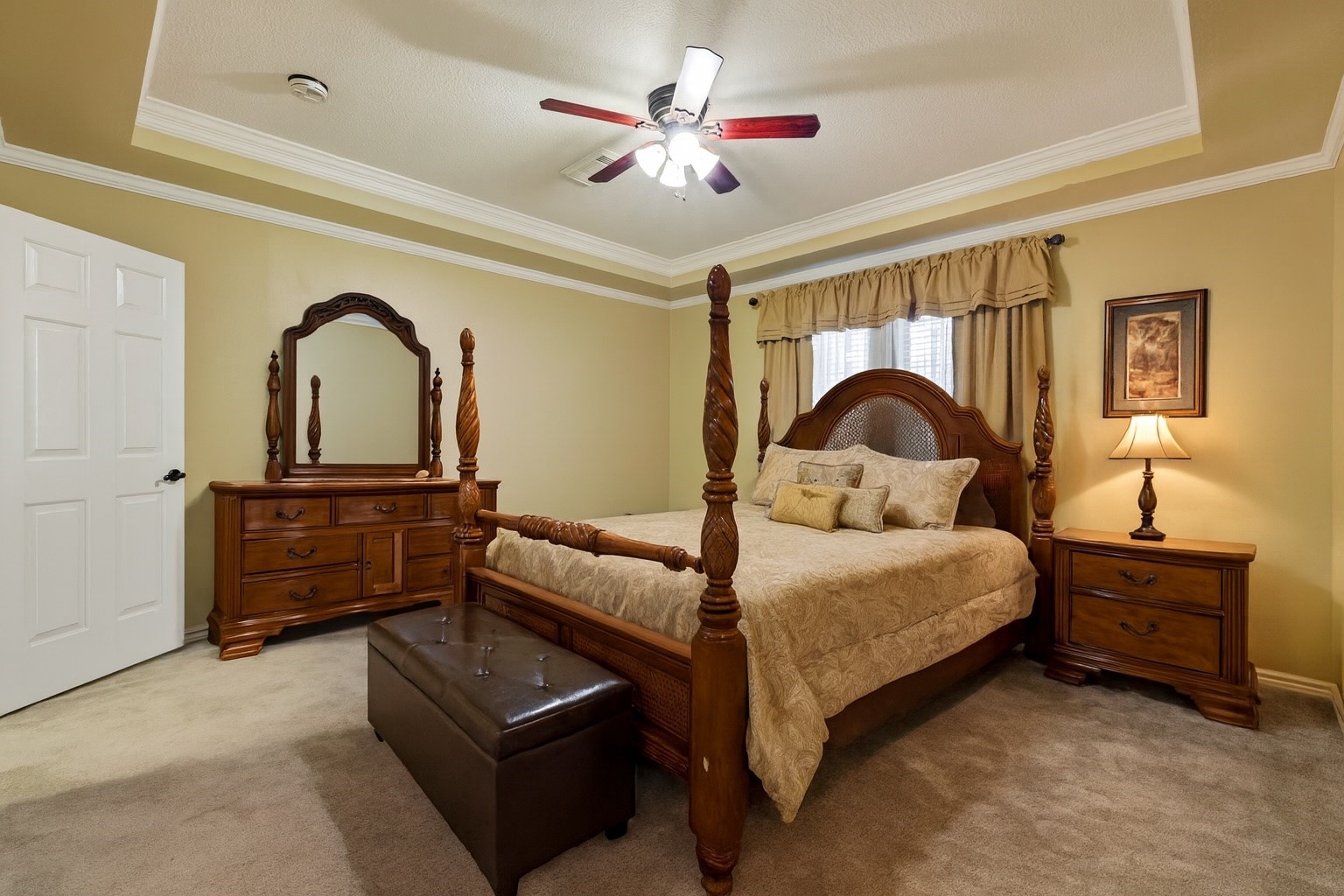 5802 Ashmere Lane Spring, TX 77379 - Photo 3 of 19 a bedroom with a bed and a dresser with mirror