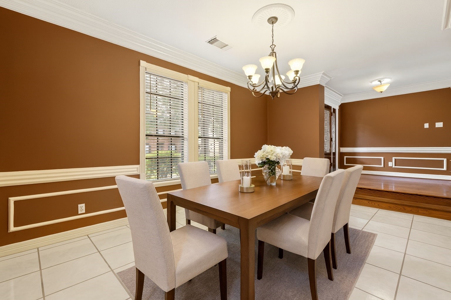 5802 Ashmere Lane Spring, TX 77379 - Photo 9 of 19 a view of a dining room with furniture a chandelier and wooden floor