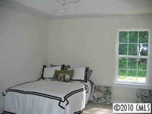 410 Danielle Way Fort Mill, SC 29715 - Photo 7 of 8 a bed sitting in a bedroom next to a window