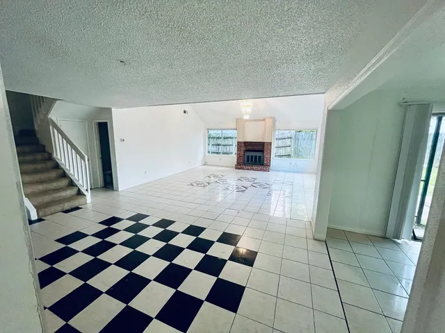 a view of a entryway with a checkered floor