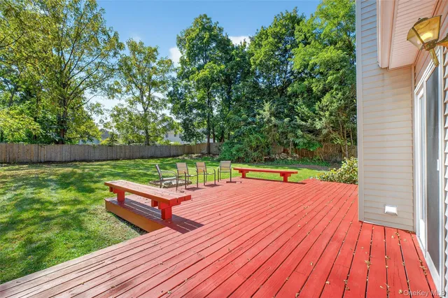 a view of a wooden deck with a yard