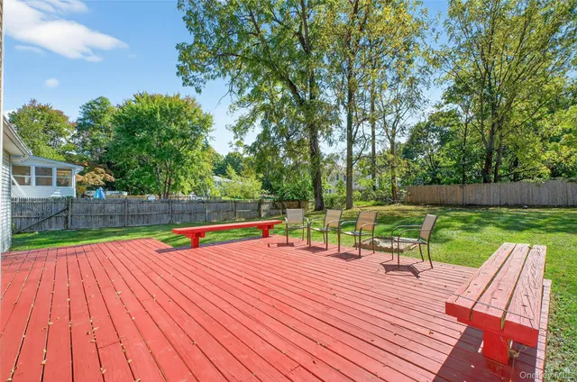 a view of a backyard with sitting area