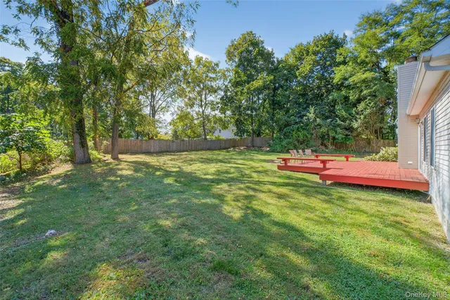 a backyard of a house with yard and fountain