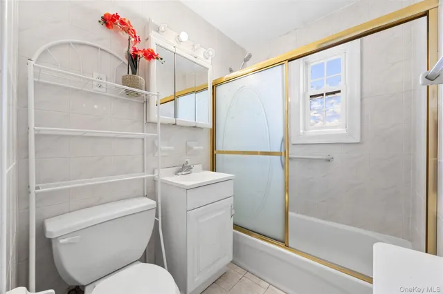 a bathroom with a toilet sink and shower