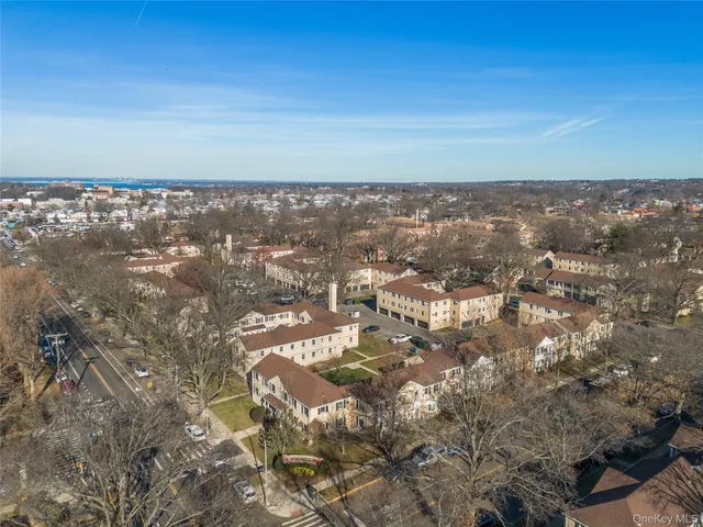 an aerial view of residential building and trees around