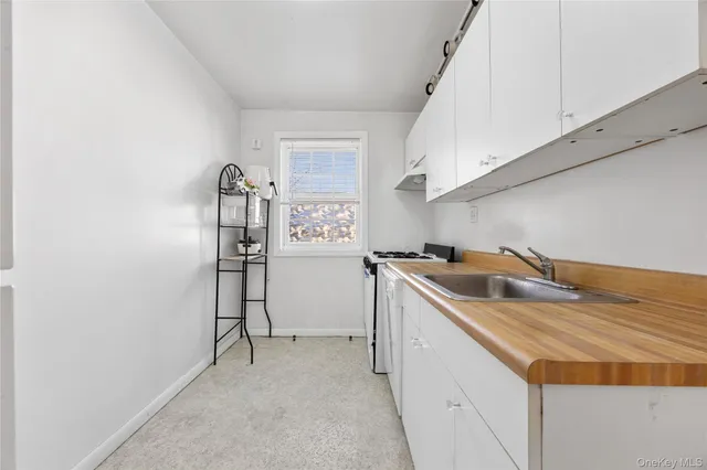 a utility room with cabinets