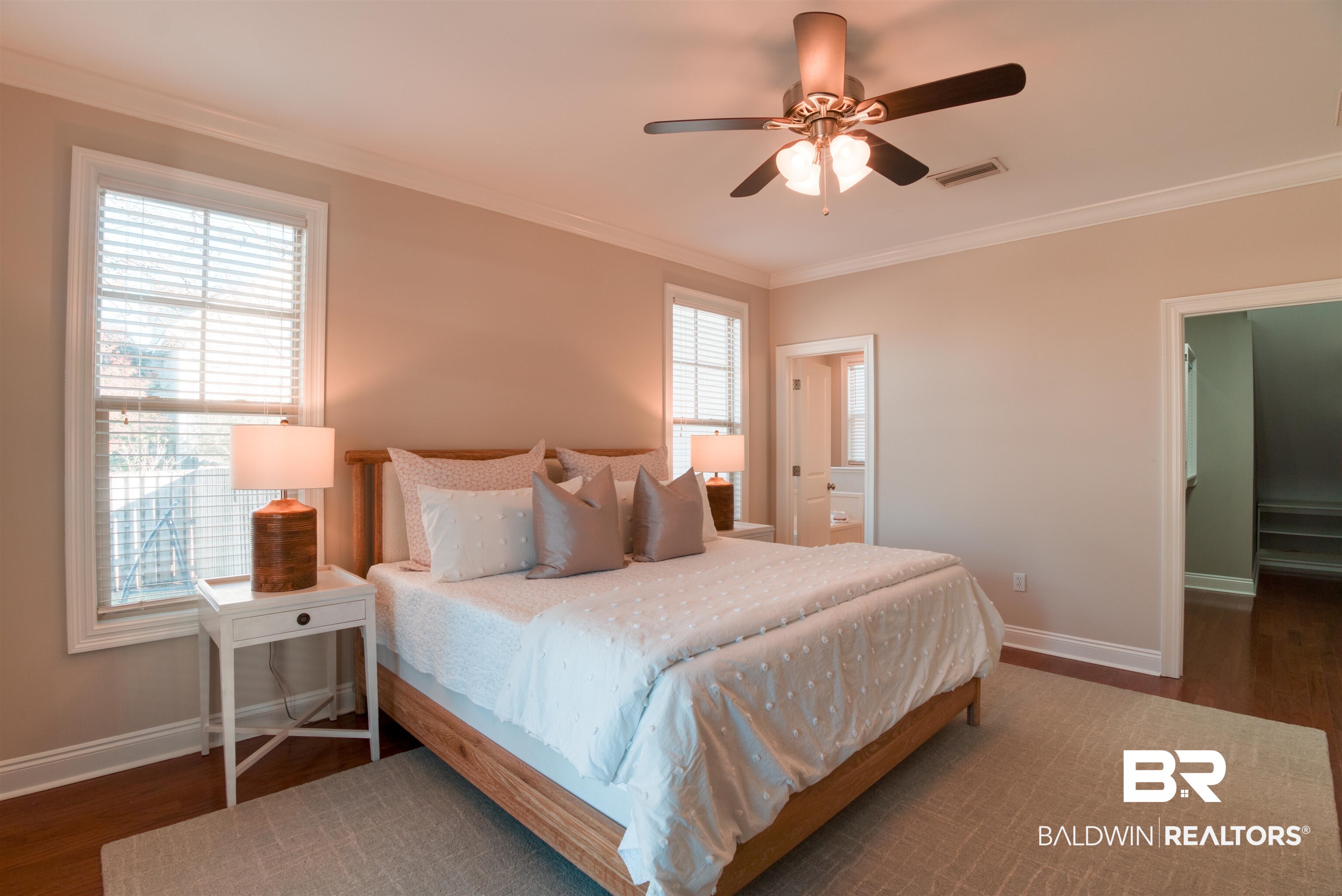 24561 Austin Road Daphne, AL 36526 - Photo 20 of 57 Bedroom with multiple windows, ceiling fan, and dark wood-type flooring