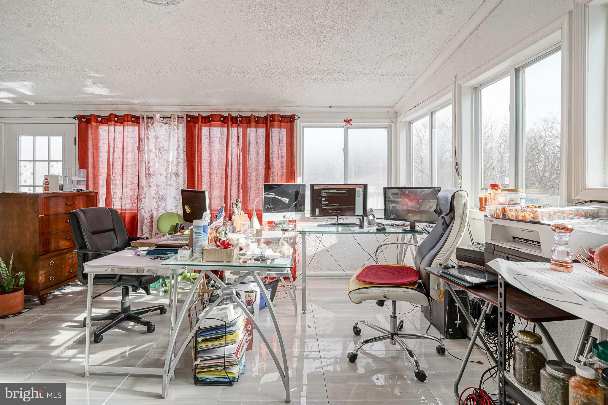 430 Monroeville Road Mullica Hill, NJ 08062 - Photo 11 of 31 a view of a workspace with furniture and a large window