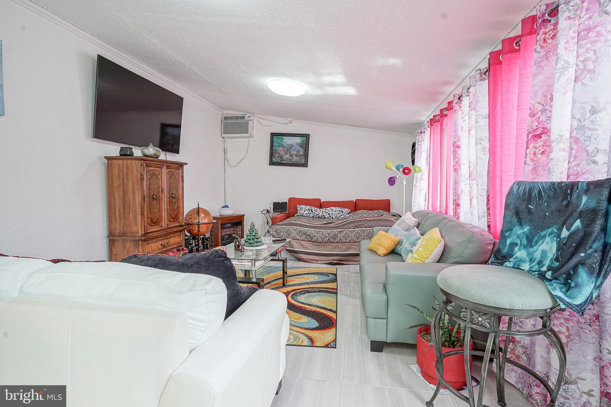 430 Monroeville Road Mullica Hill, NJ 08062 - Photo 12 of 31 a living room with furniture and a flat screen tv