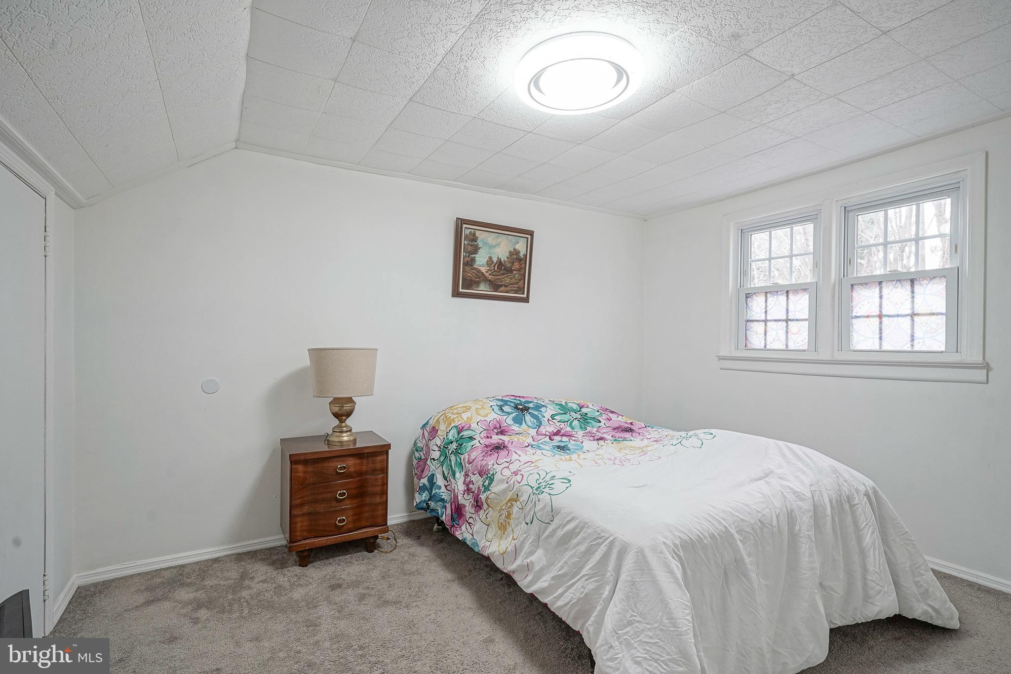 430 Monroeville Road Mullica Hill, NJ 08062 - Photo 18 of 31 a bedroom with a bed and a window