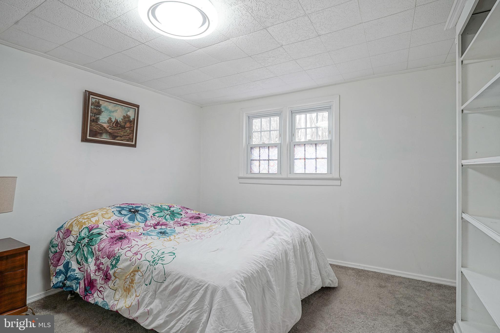 430 Monroeville Road Mullica Hill, NJ 08062 - Photo 19 of 31 a bedroom with a bed and a window