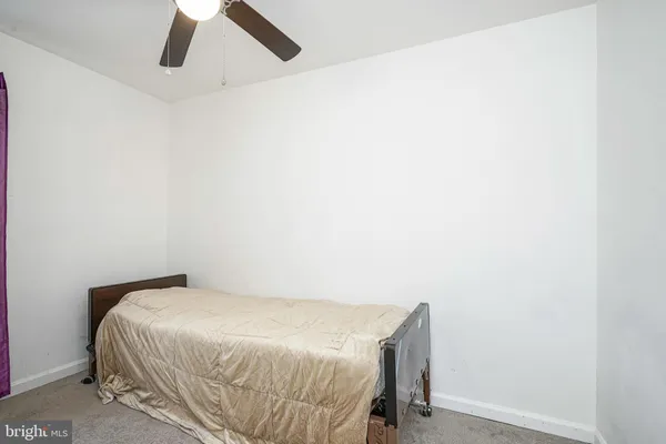 a bedroom with a bed and cabinets