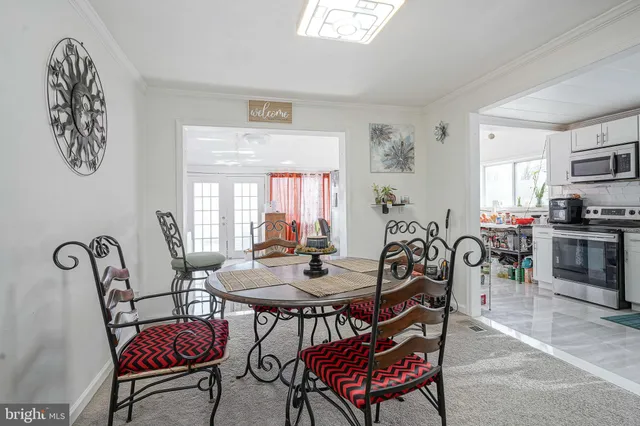 a dining room with furniture and window