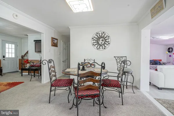 a dining room with furniture and a table