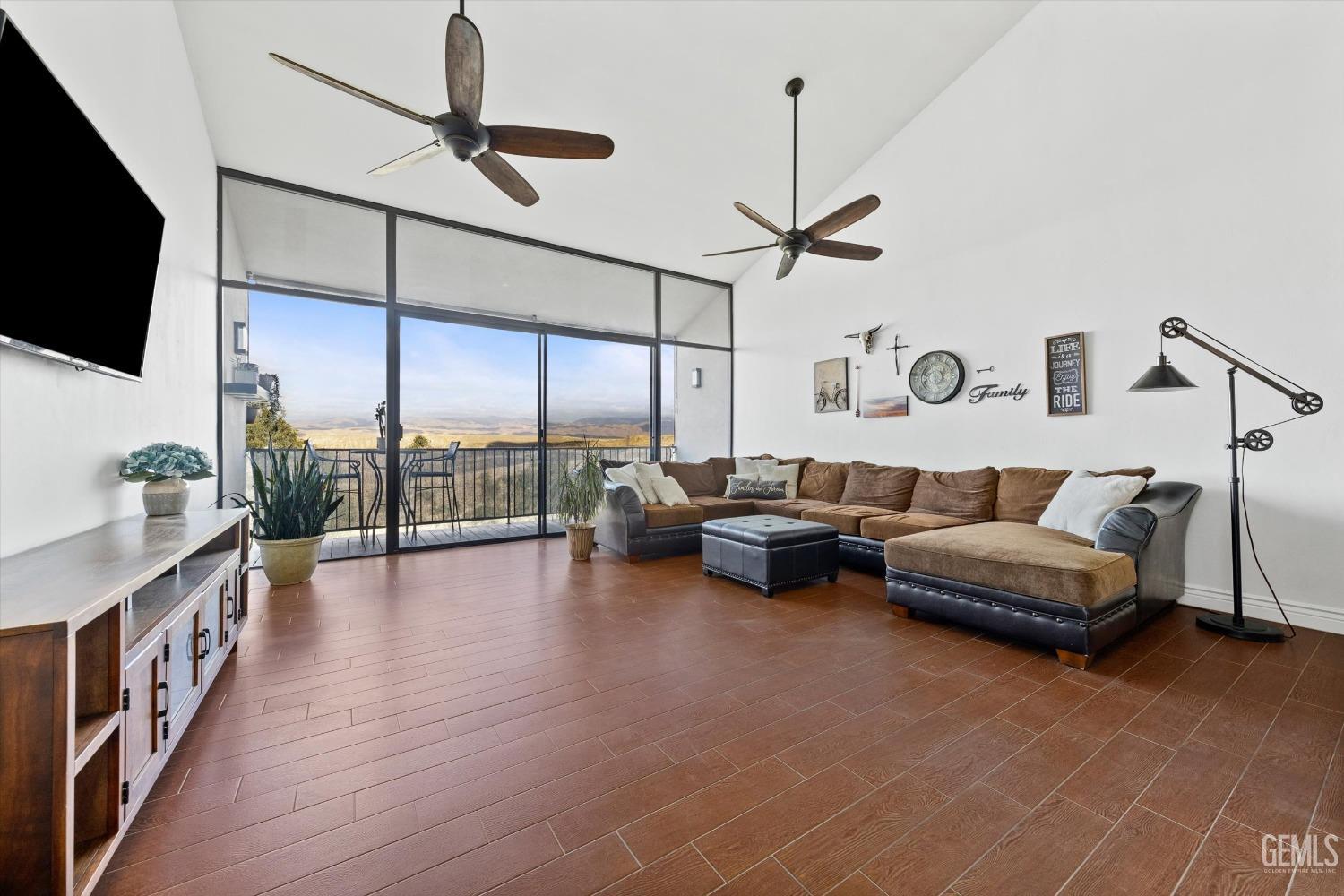 Undisclosed Address Bakersfield, CA 93306 - Photo 14 of 52 a living room with furniture and a flat screen tv